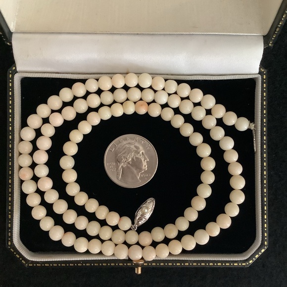 Vintage sterling silver natural angle skin white coral necklace.